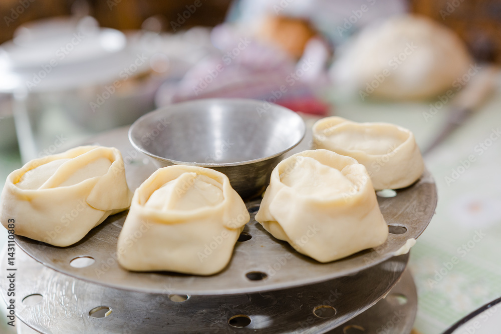 The woman molds manti. Cooking of the house, home-made food, food. The woman molds manti. Cooking of the house, home-made food, food.