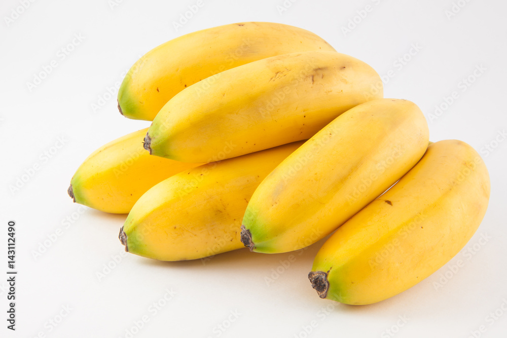 Small type of banana called murrapo (Musa acuminata) on white background