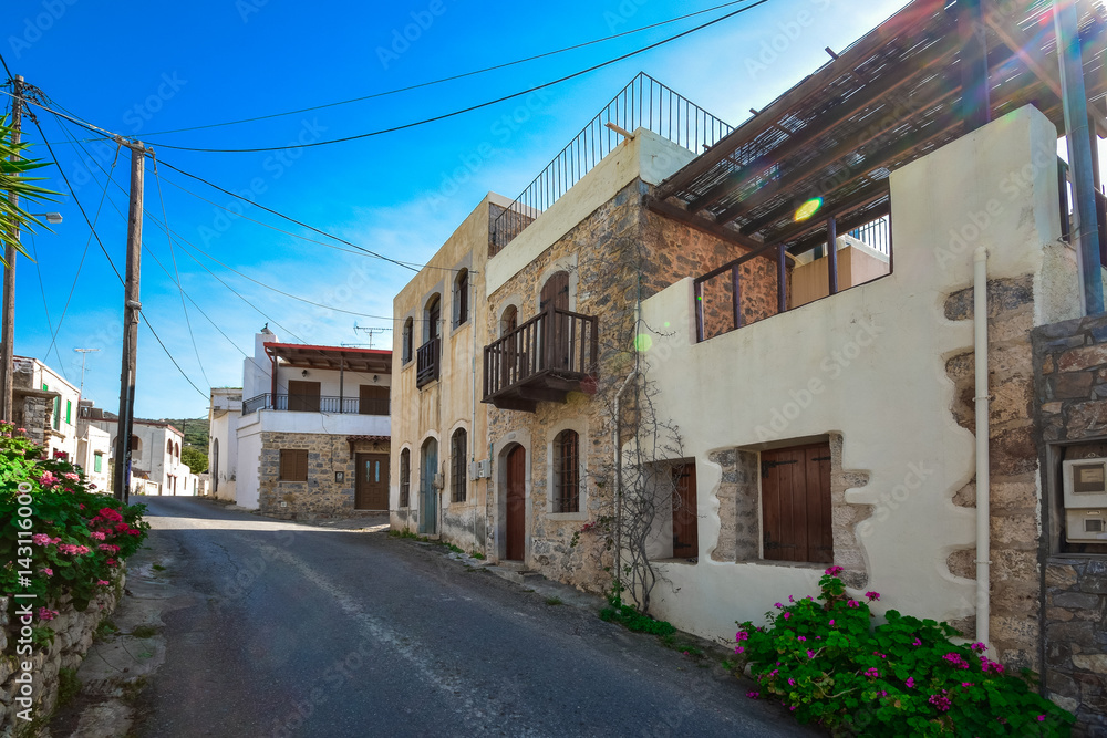 A nice traditional neighborhood with old stone houses at Milatos, Crete, Greece.