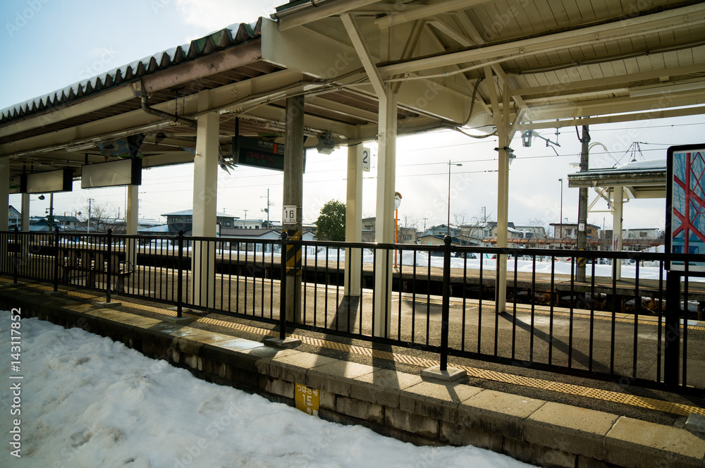 Fototapeta premium An evening train station lonely in the winter. No people.