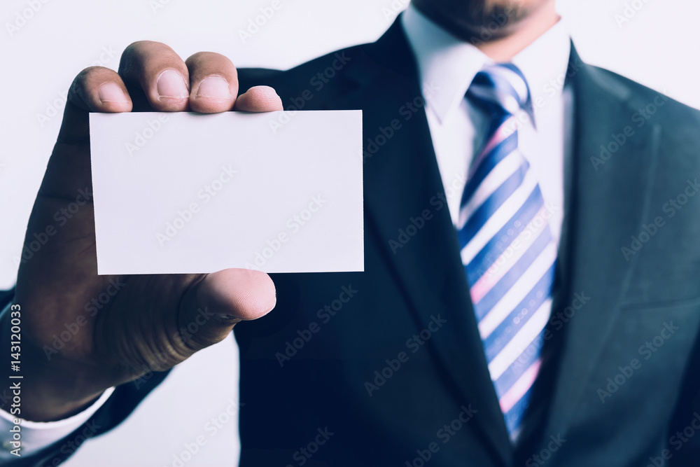 Businessman showing empty business card on his hand, white background. Businessman showing empty business card on his hand, white background.