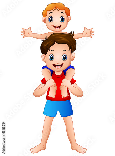 Big brother giving his little brother piggyback ride
