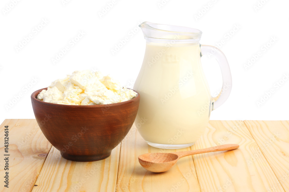 Glass jug pitcher of fresh milk with glass and cottage cheese isolated on white background carafe Glass jug pitcher of fresh milk with glass and cottage cheese isolated on white background carafe