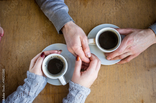 Cup of coffee for Breakfast in the hands of lovers.  photo