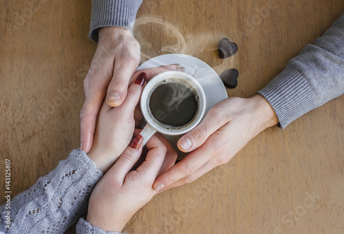 Cup of coffee for Breakfast in the hands of lovers.  photo