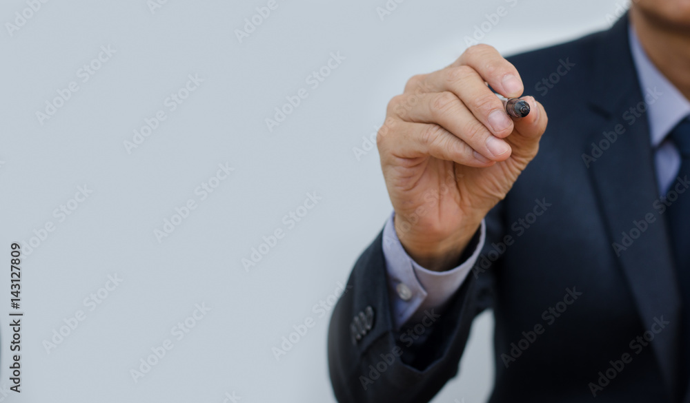 Businessman writing on screen Businessman writing on screen