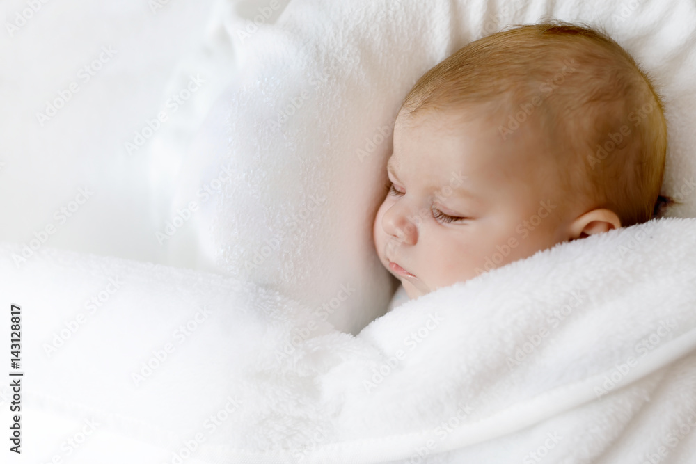 Cute little newborn baby girl sleeping wrapped in blanket Cute little newborn baby girl sleeping wrapped in blanket