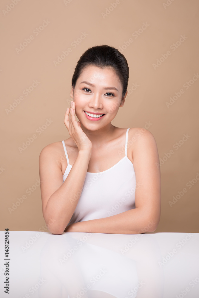Proposing a product. Beautiful spa woman showing empty copy space on the open hand palm Proposing a product. Beautiful spa woman showing empty copy space on the open hand palm