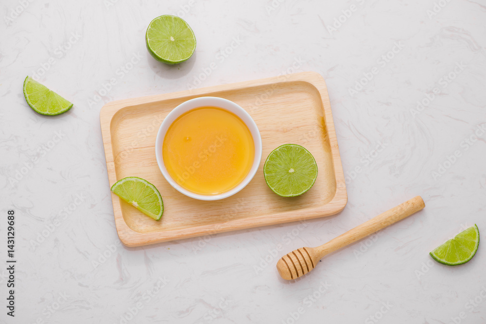 Healthy food concept. Fresh lime with honey on table Healthy food concept. Fresh lime with honey on table
