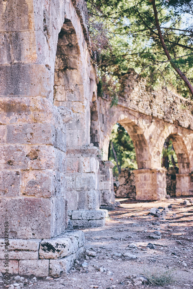 Travel and architecture. Ancient aqueduct in antique town Phaselis, Turkey.