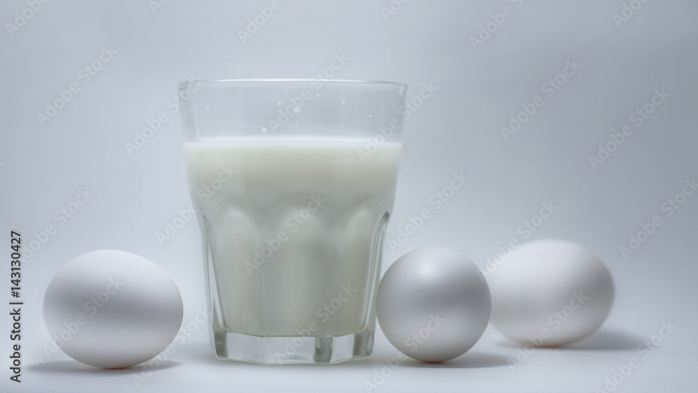 Milk in a glass jar and eggs Milk in a glass jar and eggs