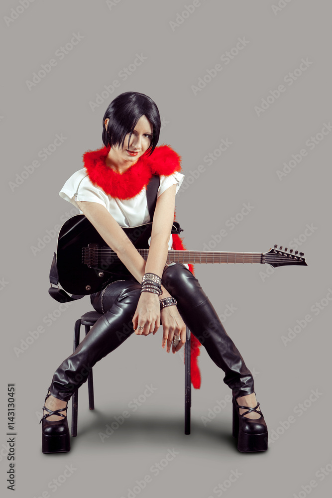 Young attractive rock girl playing the electric guitar Young attractive rock girl playing the electric guitar