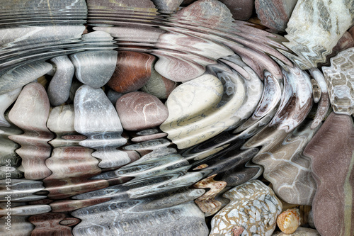 Photography Water ripples over the stone pebbles
