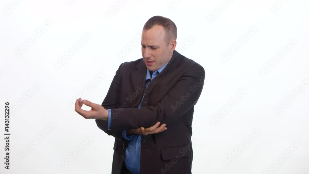 Man rubs sore elbow on white background. Man rubs sore elbow on white background.
