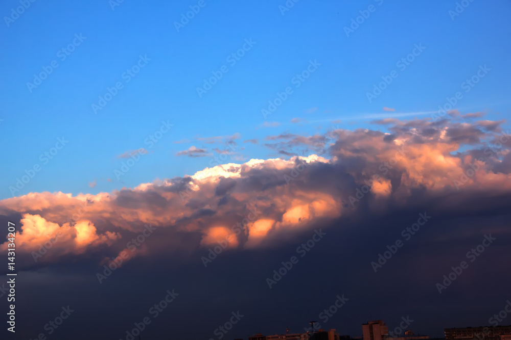 Dawn. Clouds. The clouds are colored by the rising sun.