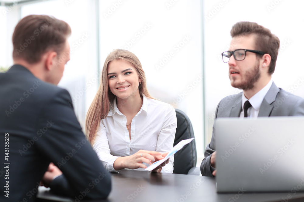 Business people working around table in modern office Business people working around table in modern office
