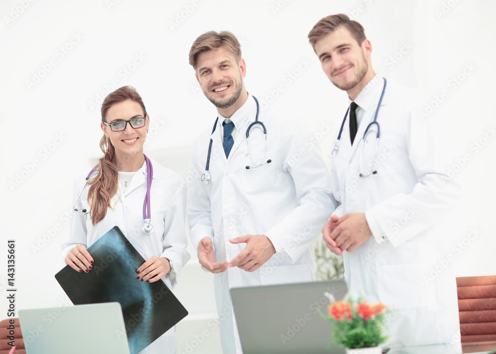 Portrait of group of smiling hospital colleagues standing togeth Portrait of group of smiling hospital colleagues standing togeth