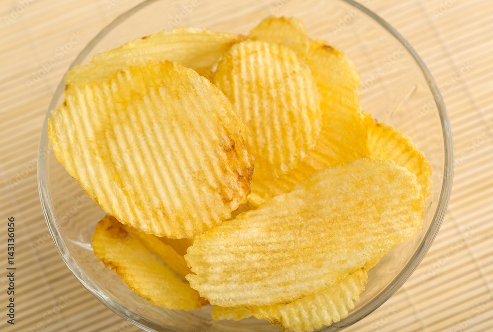 Crispy potato chips. Fast Food. Potatoes. Fatty unhealthy foods. corrugated chips Crispy potato chips. Fast Food. Potatoes. Fatty unhealthy foods. corrugated chips