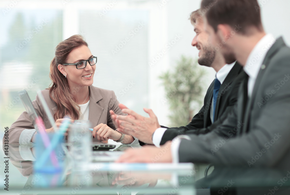 Business people working around table in modern office Business people working around table in modern office
