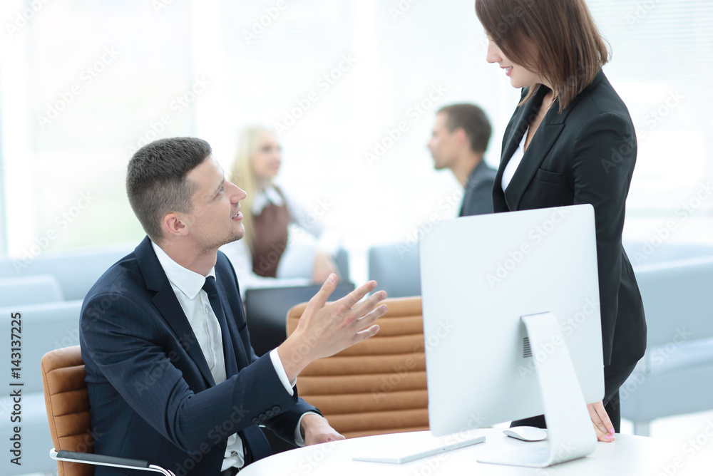 Confident business partners working in office and smiling Confident business partners working in office and smiling