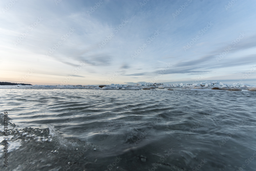 Winter landscape. Sea covered blocks of ice.