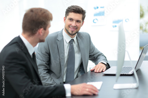 Successful business people sitting in office and planning work