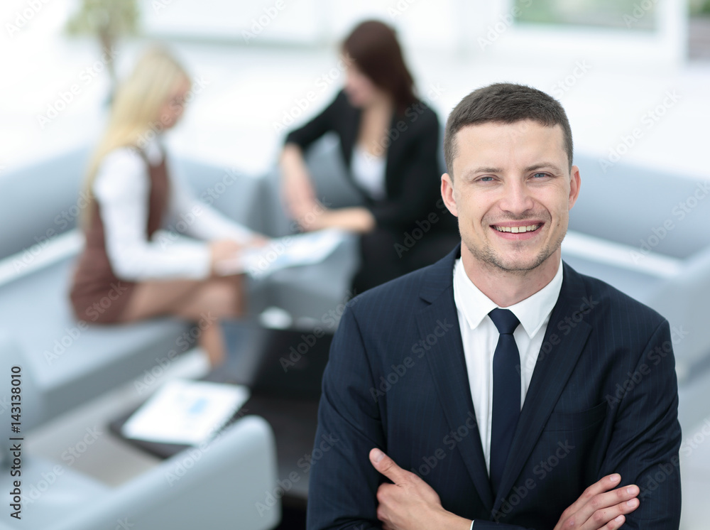 Portrait of business man looking at camera on the background of Portrait of business man looking at camera on the background of