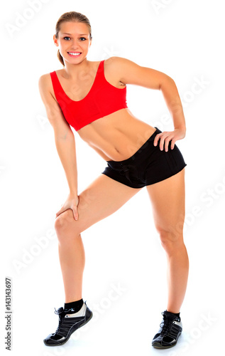 Fitness woman posing against a white background, isolated