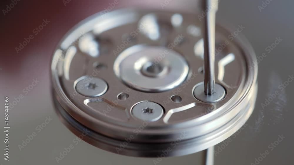 repair the hard drive. twist the screw Computer Hard Disk Drive Close Up. repair the hard drive. twist the screw Computer Hard Disk Drive Close Up.