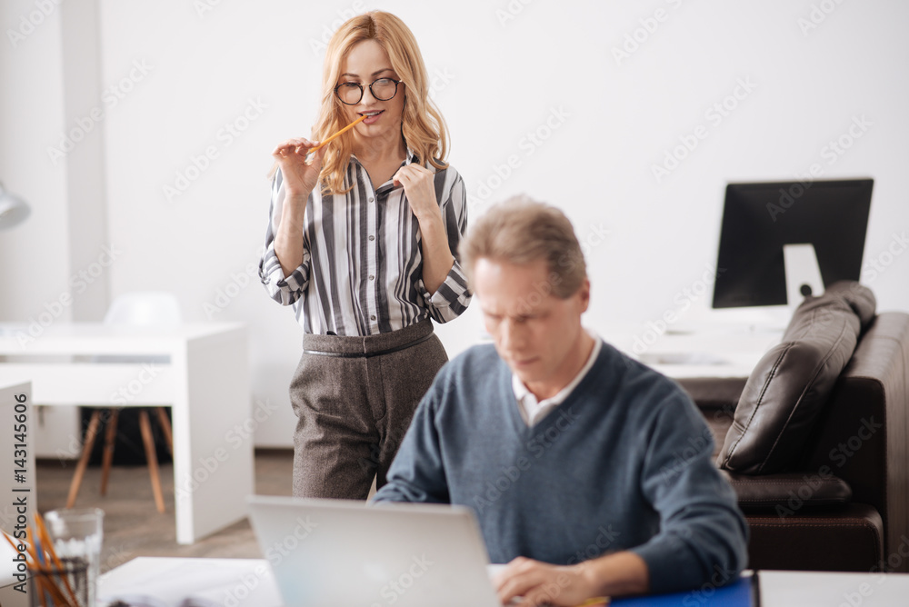 Passionate young woman seducing elderly colleague at work Passionate young woman seducing elderly colleague at work