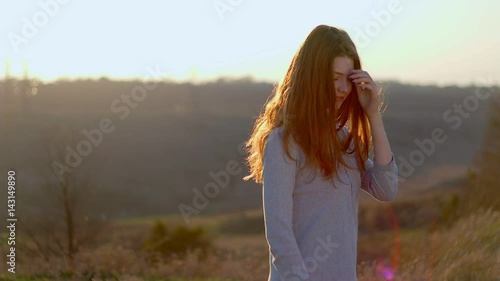 Portrait of a redhead girl at sunset photo