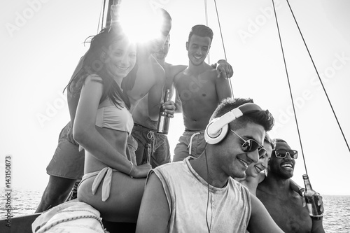 Photography Happy friends making boat party drinking beer and listening music with dj set