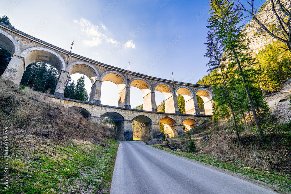 panaroama of a rail viaduct - train bridge over a valley - Semmering Bahn - unesco world heritage - "Kalte Rinne" - obrazy, fototapety, plakaty 