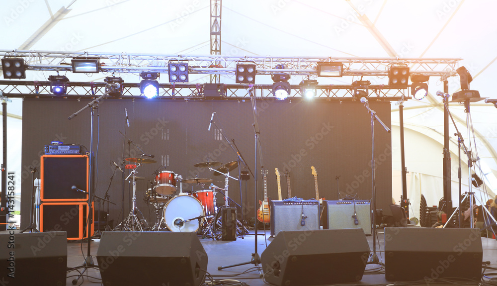 An empty Stage Before the Concert with floodlight, musical instruments