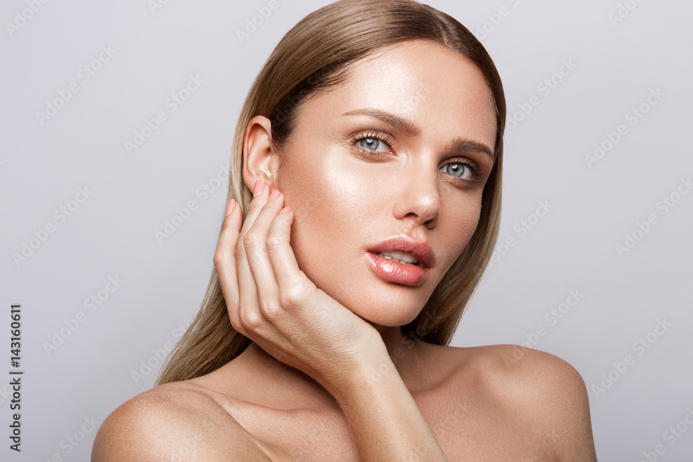 Beauty portrait of model with natural make-up. Fashion shiny highlighter on skin, sexy gloss lips make-up Beauty portrait of model with natural make-up. Fashion shiny highlighter on skin, sexy gloss lips make-up