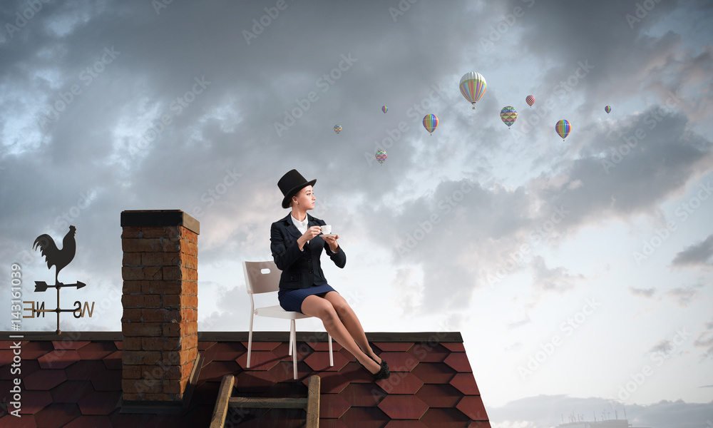 Woman banker on house top . Mixed media Woman banker on house top . Mixed media