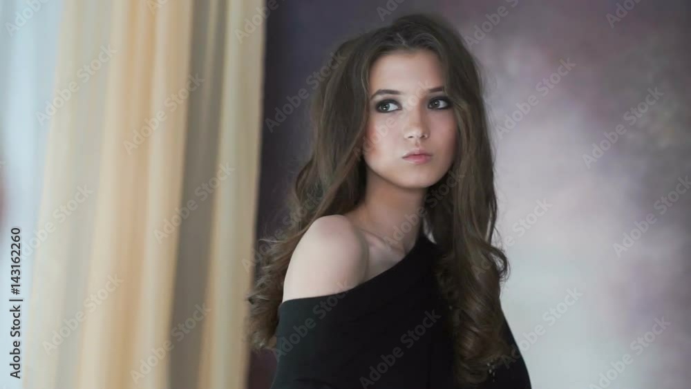 Beautiful model posing on photosession in studio. Beautiful model posing on photosession in studio.