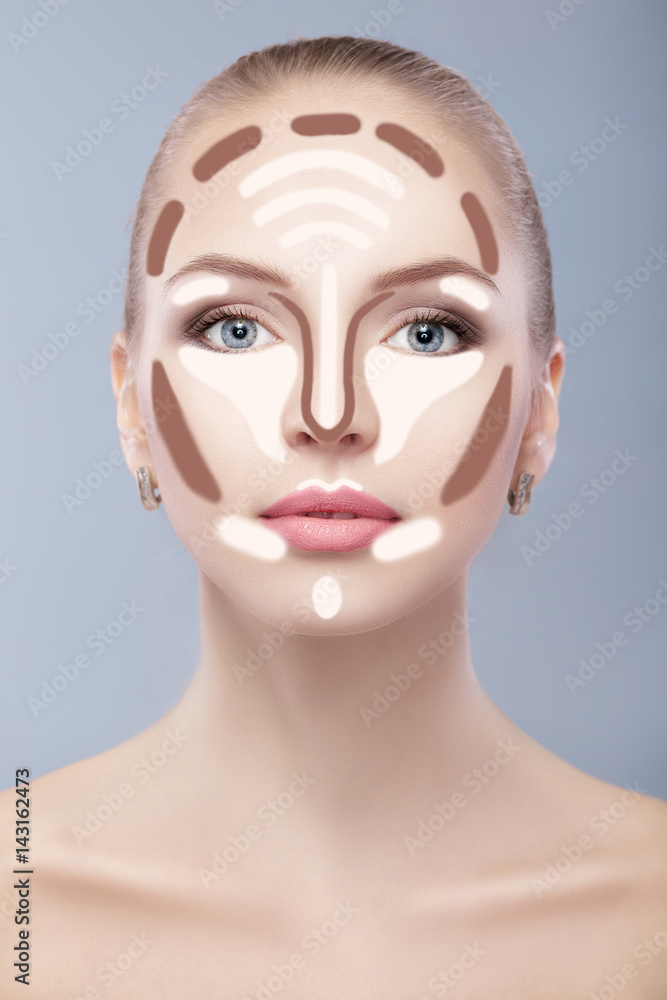 Contouring. Make up woman face on grey background. Contour and highlight makeup. Contouring. Make up woman face on grey background. Contour and highlight makeup.