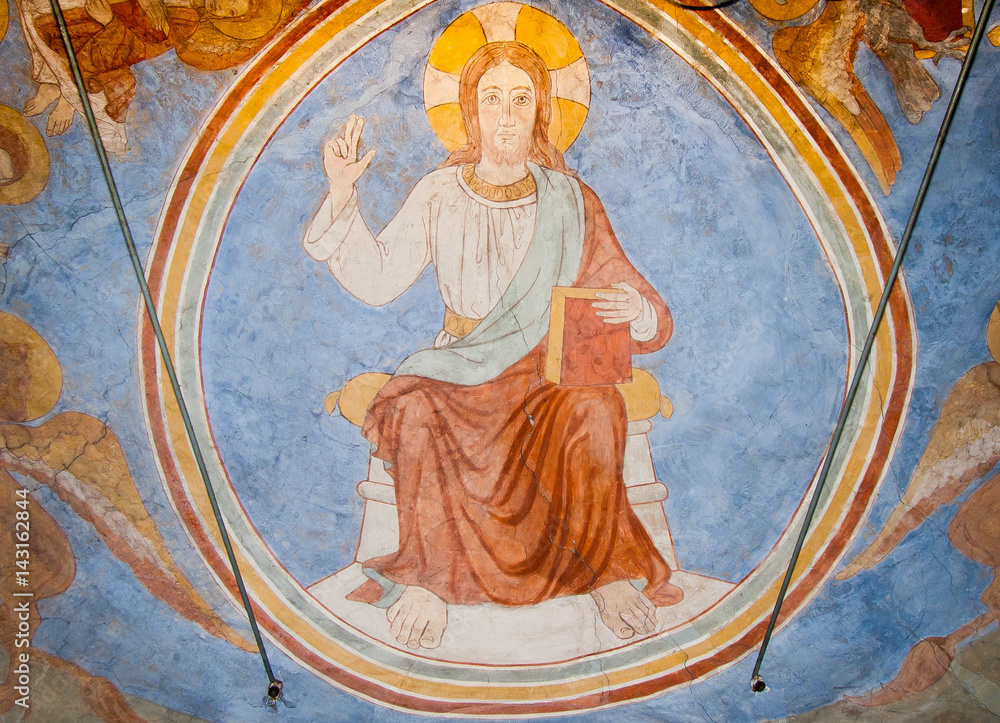 Majestas domini. Medieval mural of Christ , sitting on a throne.
