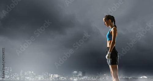 Young boxer woman outdoor . Mixed media . Mixed media