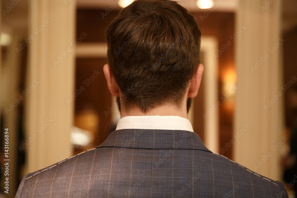 Back view of man in suit Back view of man in suit