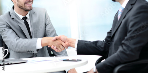 Wallpaper Mural Business handshake. Two business people shaking hands in office. Torontodigital.ca