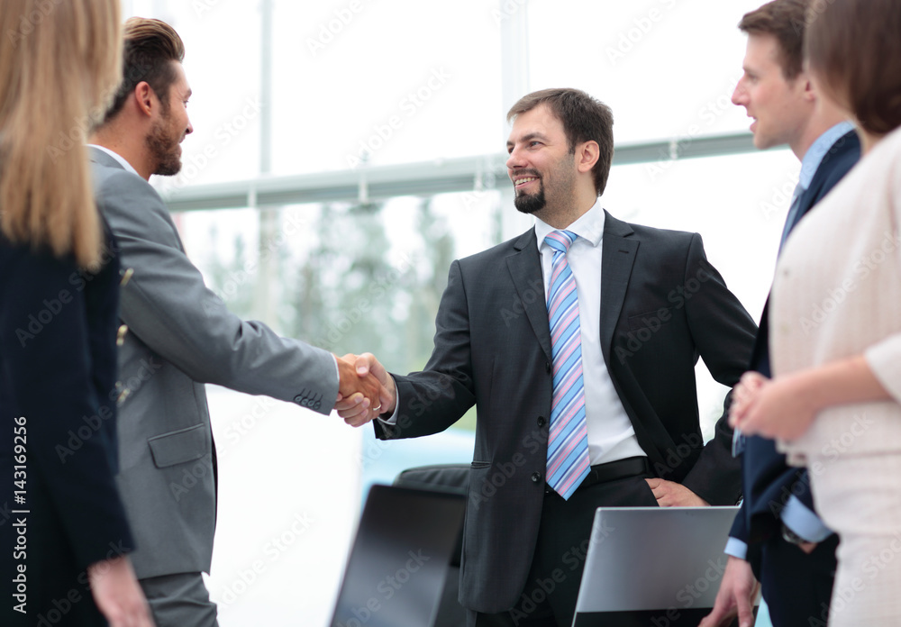 Business people shaking hands, finishing up a meeting Business people shaking hands, finishing up a meeting