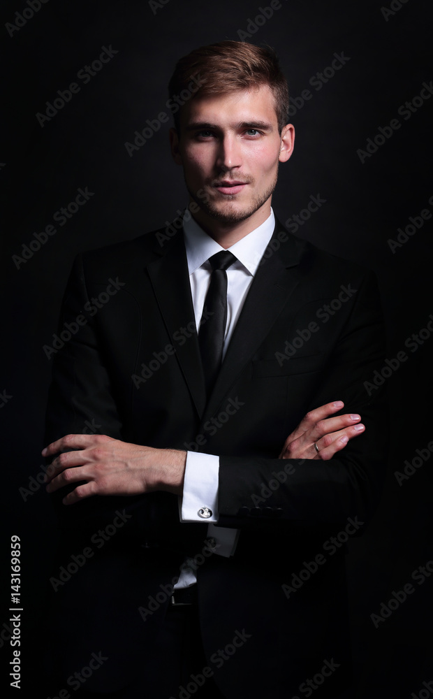 Full-length portrait of business man with arms crossed on black Full-length portrait of business man with arms crossed on black