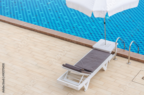 Chair and swimming pool in hotel