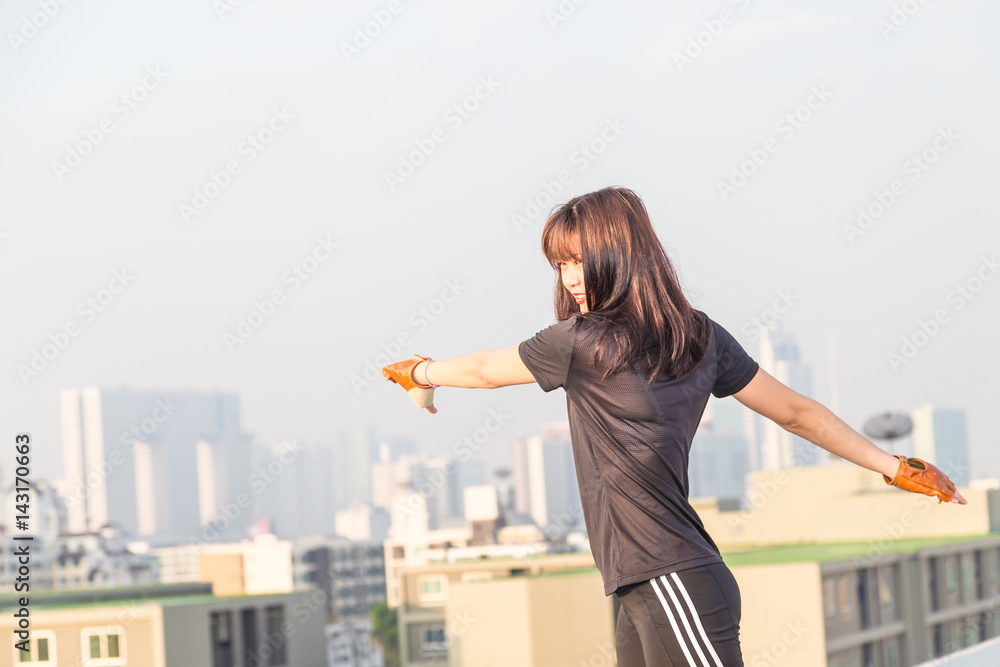 Women make body stretch before working out Women make body stretch before working out