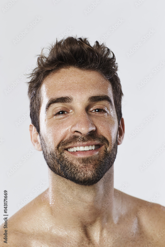 Portrait of dude sweating in studio, smiling Portrait of dude sweating in studio, smiling