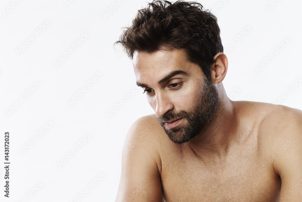 Brown eyed guy looking down, studio Brown eyed guy looking down, studio