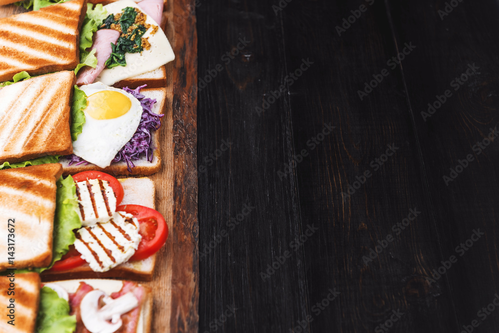 Six sandwiches with different ingredients Six sandwiches with different ingredients