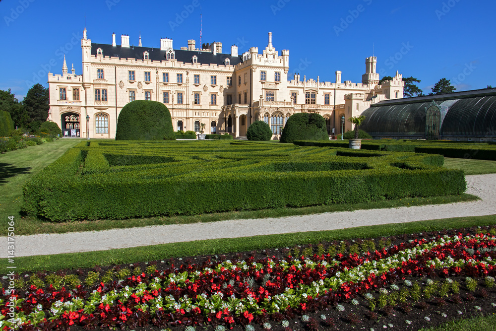 Romantic castle Lednice with flower garden at summer day, Czech republic